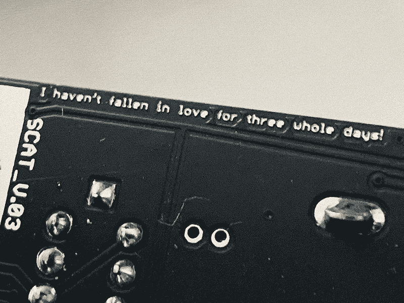 text on pcb of 000 distortion module saying I havent fallen in love for three whole days